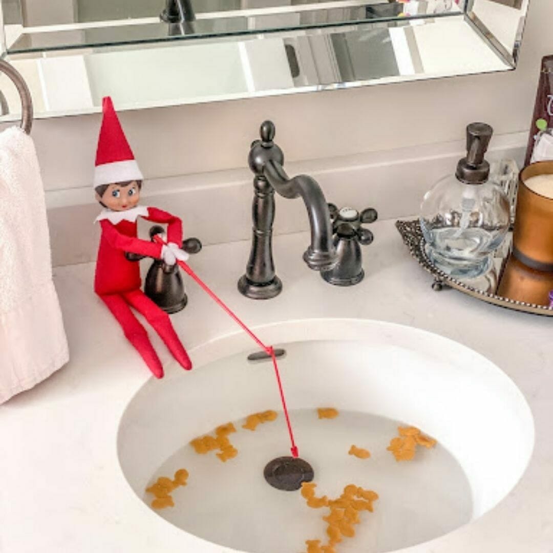 elf goes fishing in basin